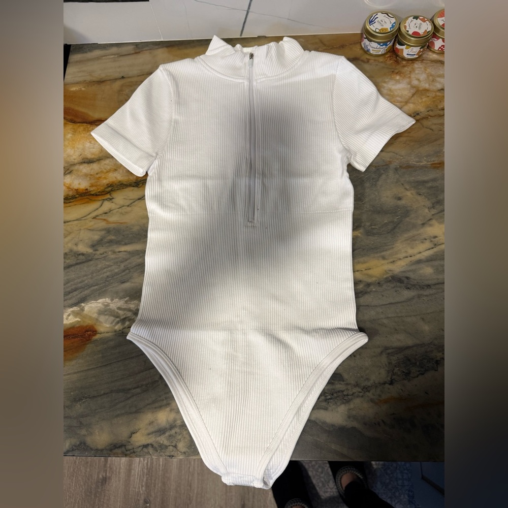 OQQ Women’s Ribbed Zip-Front One-Piece Bodysuit in White SIZE SMALL